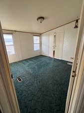 Unfurnished bedroom with carpet