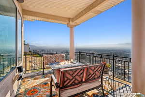 Balcony featuring an outdoor fire pit and a mountain view