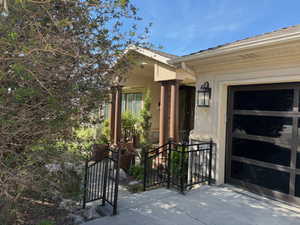 Property entrance featuring stucco siding