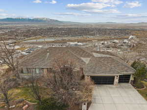 View from above of property with a mountain backdrop