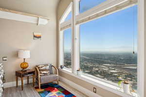 Sitting room featuring light wood-style floors and baseboards