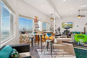 Dining room with tile patterned floors, a ceiling fan, and recessed lighting