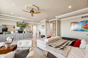 Bedroom featuring ornamental molding, light wood-style flooring, and recessed lighting