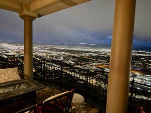 Balcony featuring a view of city lights
