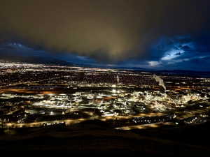 Twilight view of city featuring a mountain view