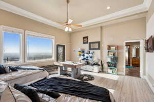 Bedroom featuring light wood finished floors, ornamental molding, ceiling fan, and recessed lighting