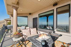 Balcony with an outdoor living space with a fire pit