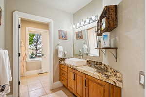 Bathroom featuring vanity and light tile patterned flooring