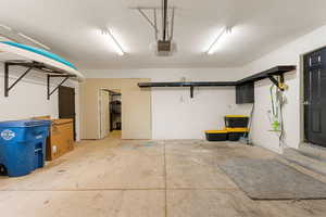 Garage featuring a garage door opener