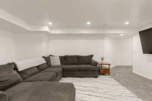 Living room featuring carpet floors and recessed lighting