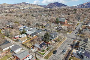 Aerial perspective of suburban area featuring a mountain backdrop