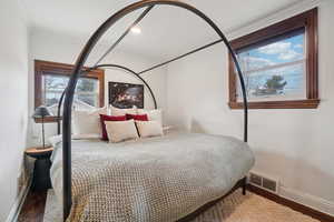 Bedroom featuring wood finished floors and recessed lighting