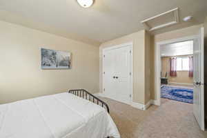 Bedroom with carpet flooring and a closet