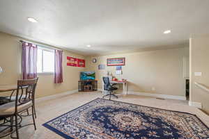 Office space featuring light carpet and recessed lighting