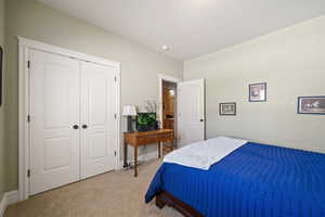 Bedroom with carpet flooring and a closet