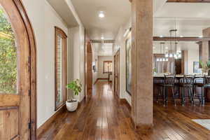 Corridor featuring dark wood finished floors and recessed lighting