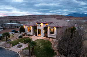 Everlights for year round Holiday lighting, a tiled roof, and stucco siding