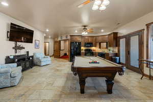 Rec room with stone tile flooring, pool table, ceiling fan, and recessed lighting