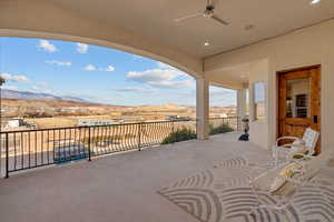 View of patio featuring a ceiling fan and a mountain view
