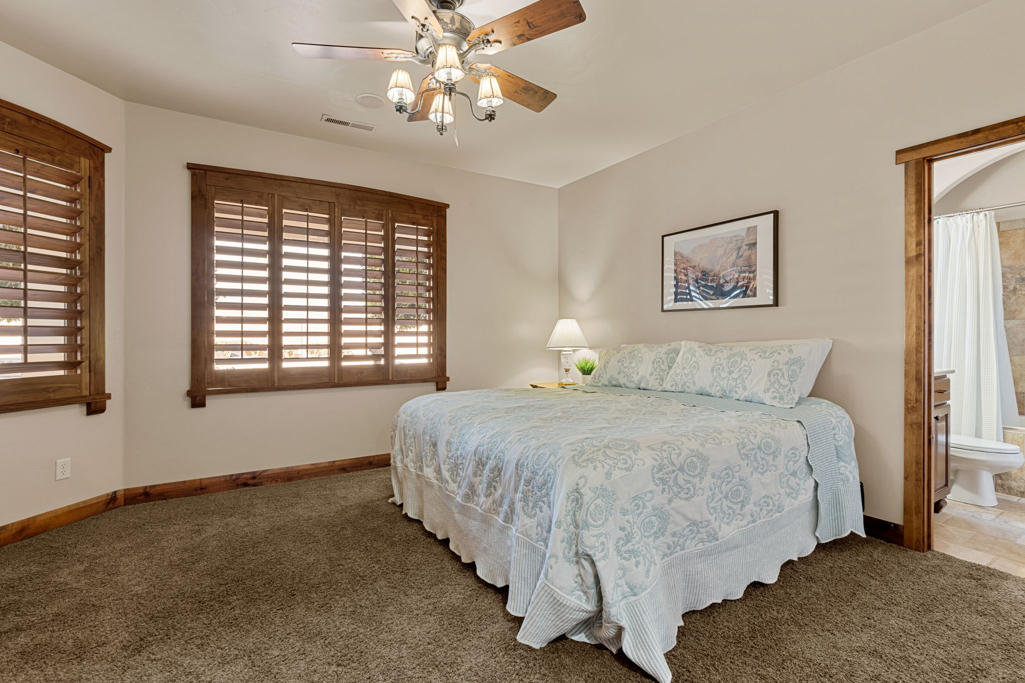 bedroom #3 with ceiling fan and ensuite bathroom