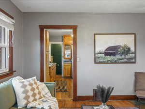 Sitting room featuring light wood finished floors and baseboards