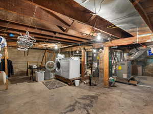 Unfinished basement with washer and dryer