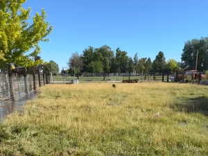 View of yard with a rural view