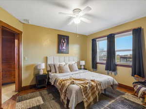 Bedroom featuring wood finished floors and ceiling fan