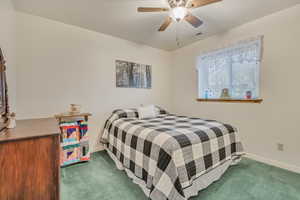 Bedroom featuring carpet and ceiling fan