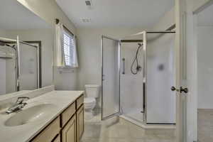 Bathroom with vanity and a shower stall