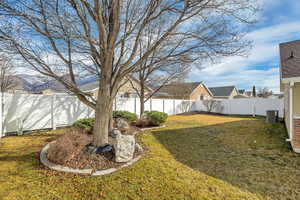 Fenced backyard with a residential view