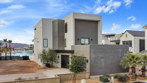 Modern home featuring stucco siding and a mountain view