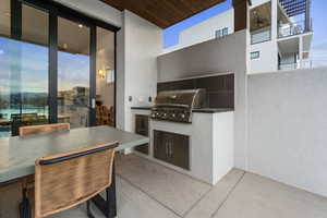 View of patio featuring an outdoor kitchen / dining area