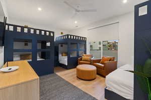 Bedroom with light wood-type flooring, recessed lighting, and a ceiling fan