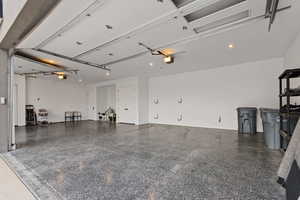 Garage featuring baseboards