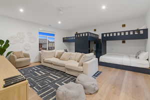 Bedroom featuring light wood-style flooring, recessed lighting, and ceiling fan