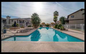 Community pool with a patio area