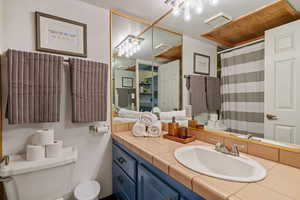 Full bathroom featuring a shower with curtain and vanity