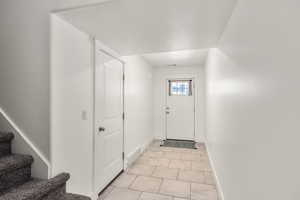 Entryway featuring a textured ceiling and tile patterned flooring