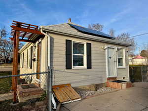 Side view of house, with crawl space entrance