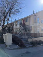 View of building exterior featuring stairway