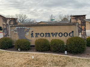 Community / neighborhood sign with a lawn