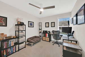 Office featuring light carpet and ceiling fan