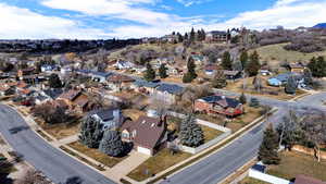 Aerial overview of property's location featuring nearby suburban area