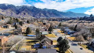 Aerial perspective of suburban area featuring a mountain backdrop
