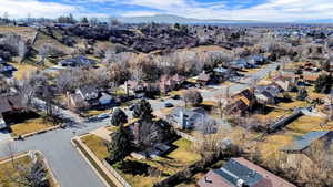 Aerial perspective of suburban area with a mountainous background