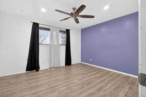 Unfurnished room with light wood-style flooring, ceiling fan, and recessed lighting