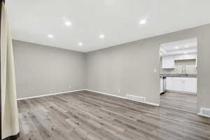 Unfurnished living room featuring recessed lighting and light wood finished floors