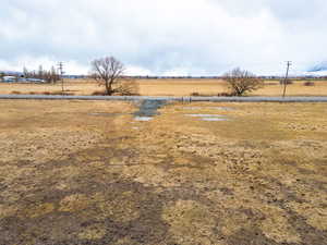 View of yard with a rural view