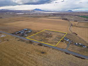 View of rural area featuring property parcel outlined and mountains